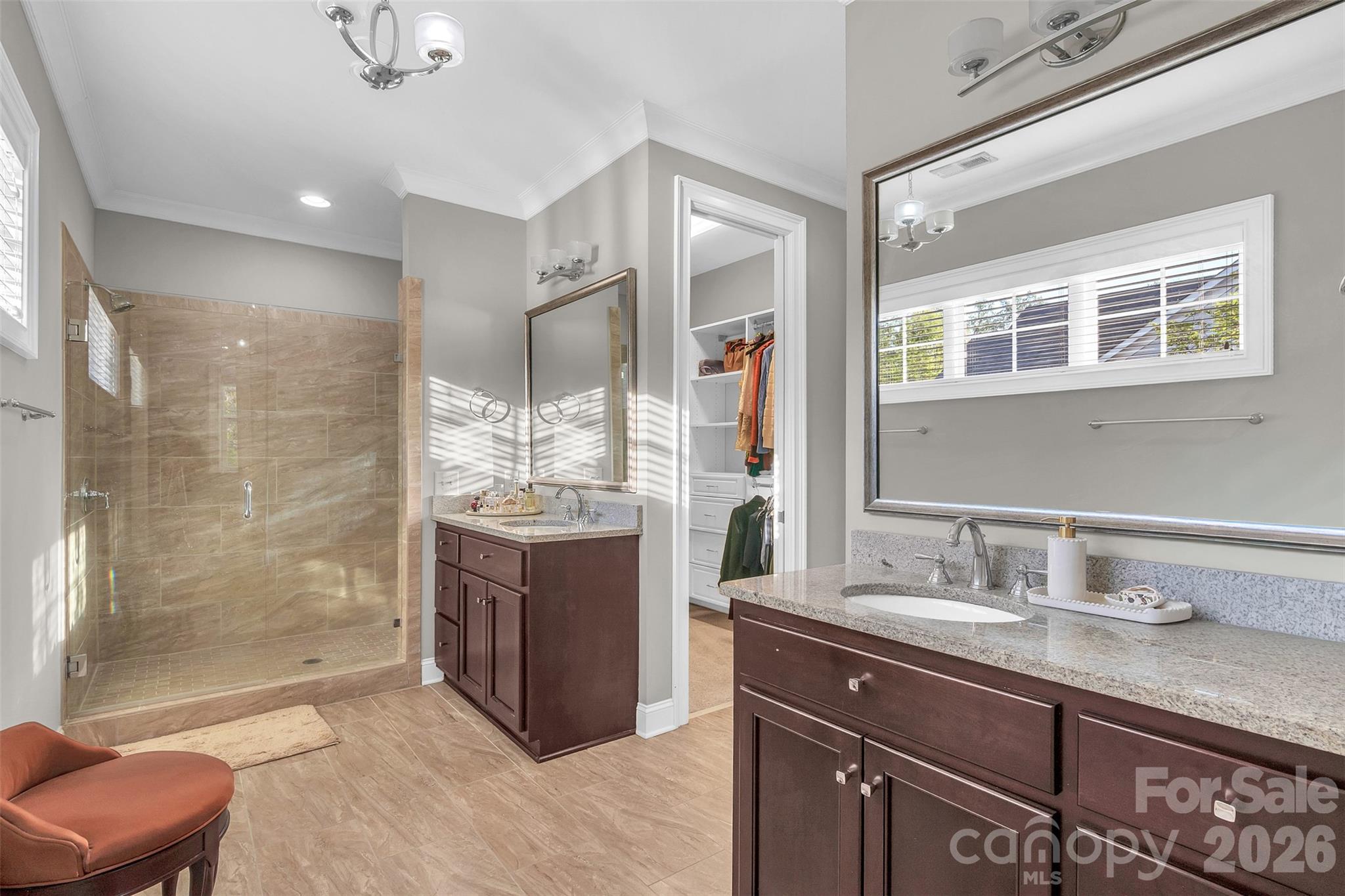 131 Boyce Road Charlotte, NC 28211 - Photo 45 of 48 a bathroom with a granite countertop sink a mirror and a shower