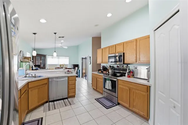 a kitchen with appliances cabinets and furniture