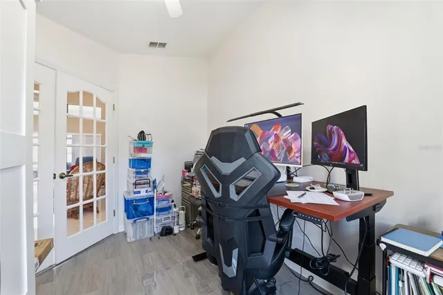 a bedroom with furniture and wooden floor