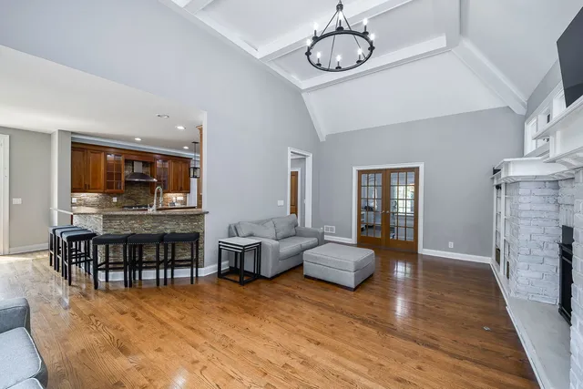 a living room with furniture ceiling fan and a window