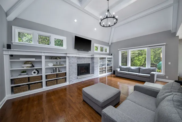 a view of a livingroom with furniture window and wooden floor