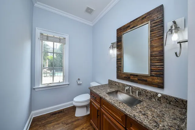 a kitchen that has a sink and a stove