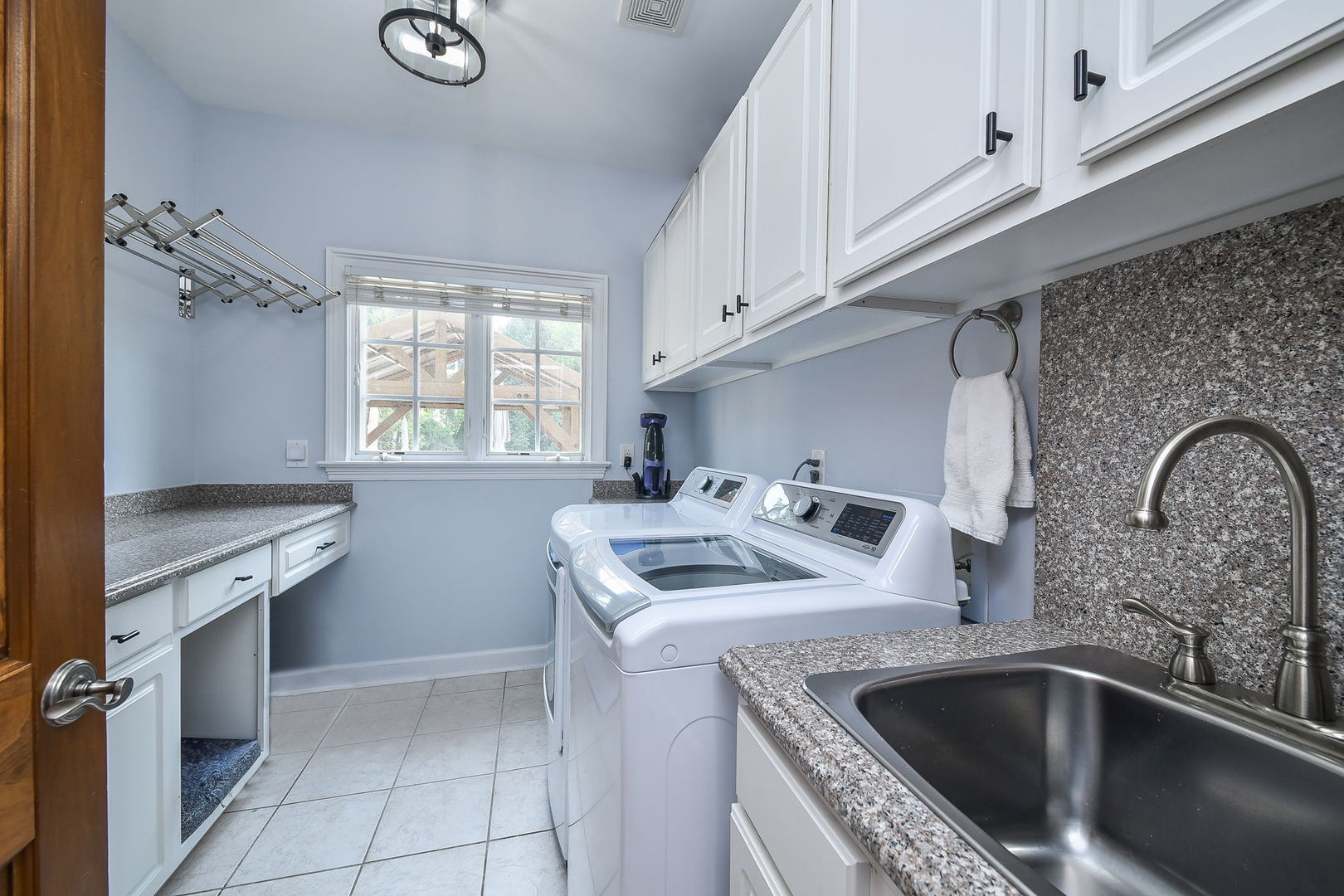 3N943 Walt Whitman Road St. Charles, IL 60175 - Photo 18 of 43 a kitchen that has a sink and a stove