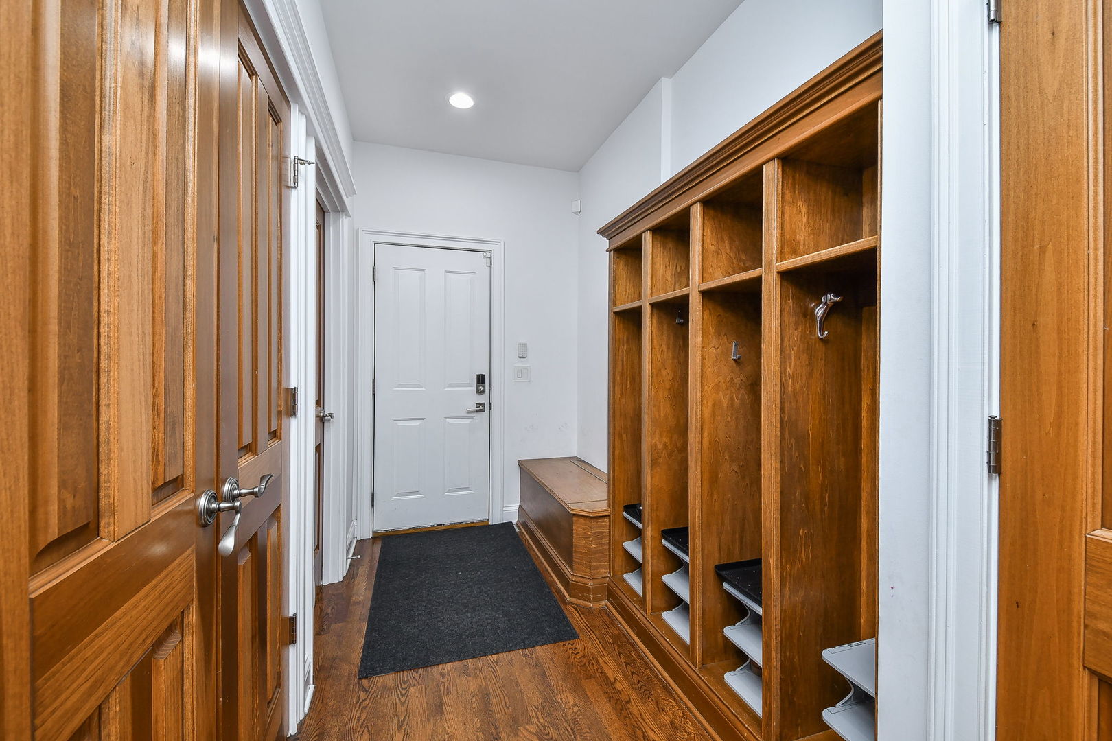 3N943 Walt Whitman Road St. Charles, IL 60175 - Photo 19 of 43 a view of a hallway with wooden floor and staircase