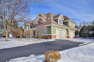 3N943 Walt Whitman Road St. Charles, IL 60175 - Photo 2 of 43 a view of a big house with large windows and a road