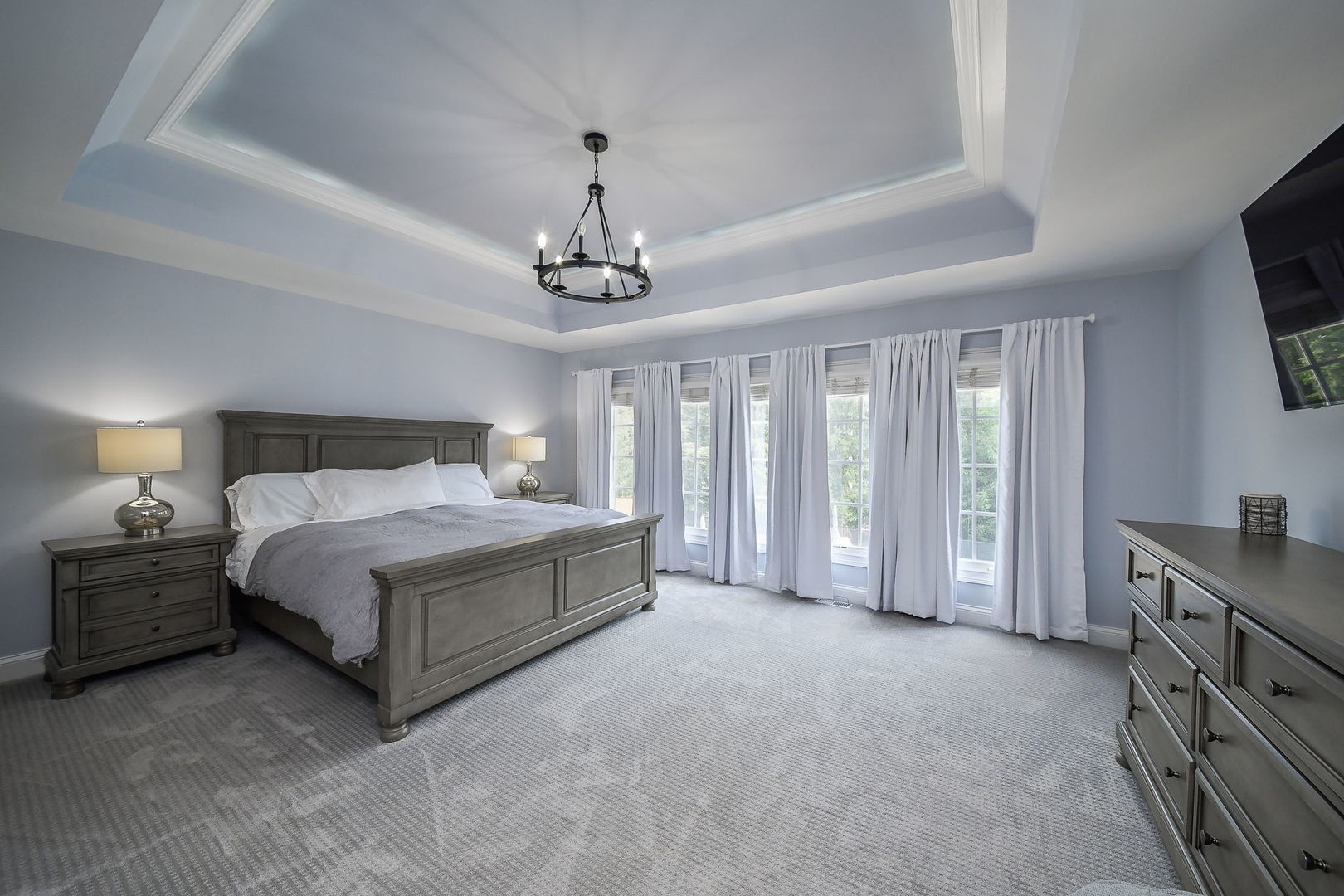 3N943 Walt Whitman Road St. Charles, IL 60175 - Photo 22 of 44 a spacious bedroom with a large bed and a flat tv screen on dresser