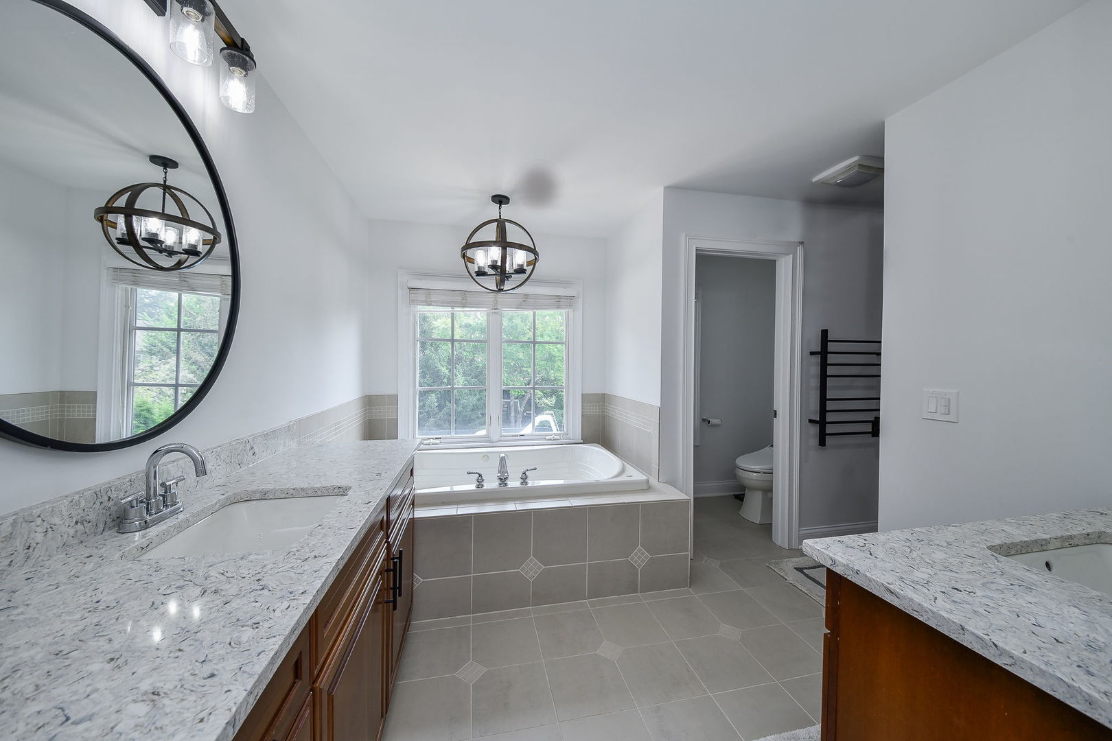 3N943 Walt Whitman Road St. Charles, IL 60175 - Photo 23 of 44 a bathroom with a granite countertop sink mirror and bathtub