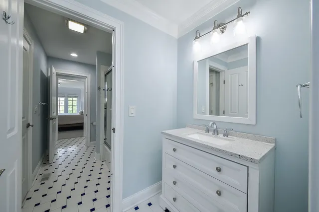 a bathroom with a glass shower door