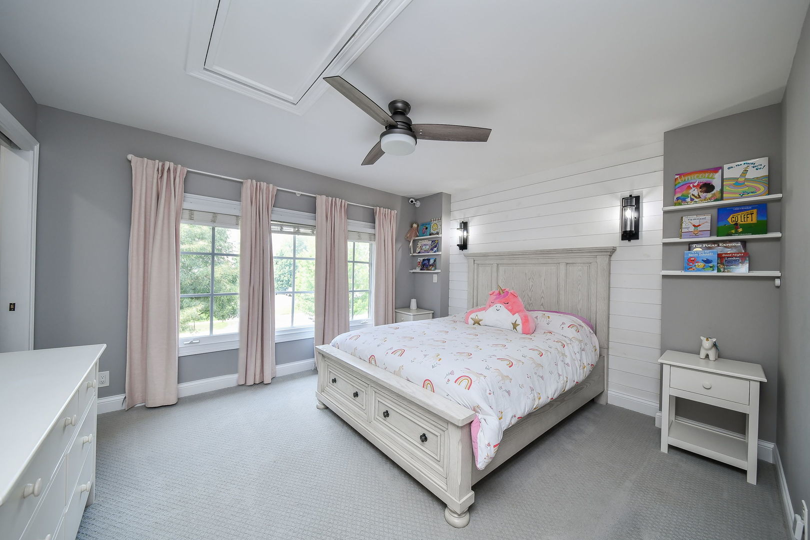 3N943 Walt Whitman Road St. Charles, IL 60175 - Photo 30 of 44 a bedroom with a bed and a chandelier