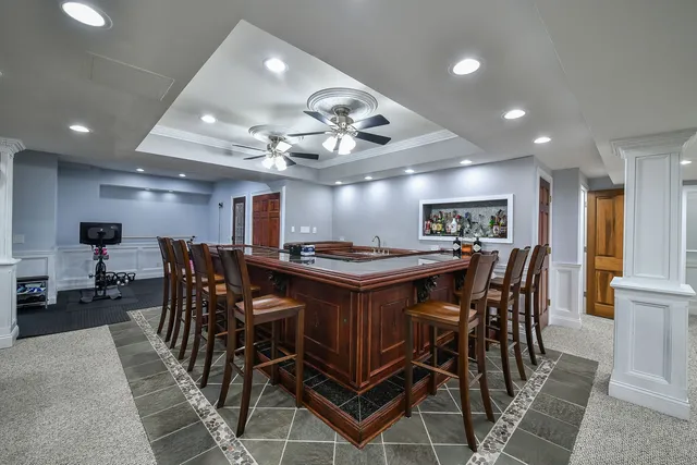 a room with furniture and air hockey table