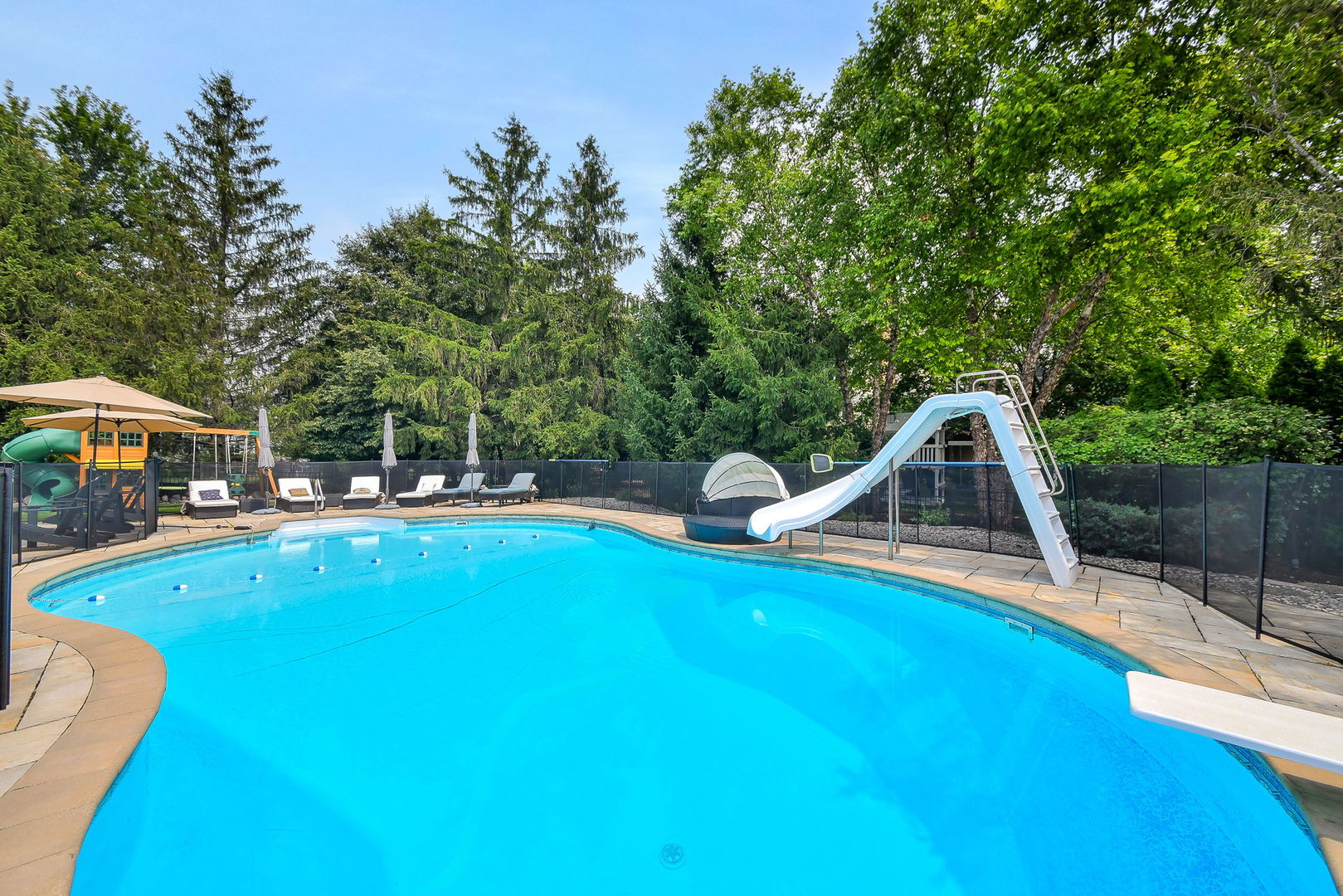 3N943 Walt Whitman Road St. Charles, IL 60175 - Photo 43 of 43 a view of a swimming pool with a patio and a yard