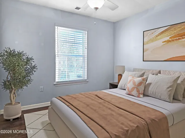 a bedroom with bed and window