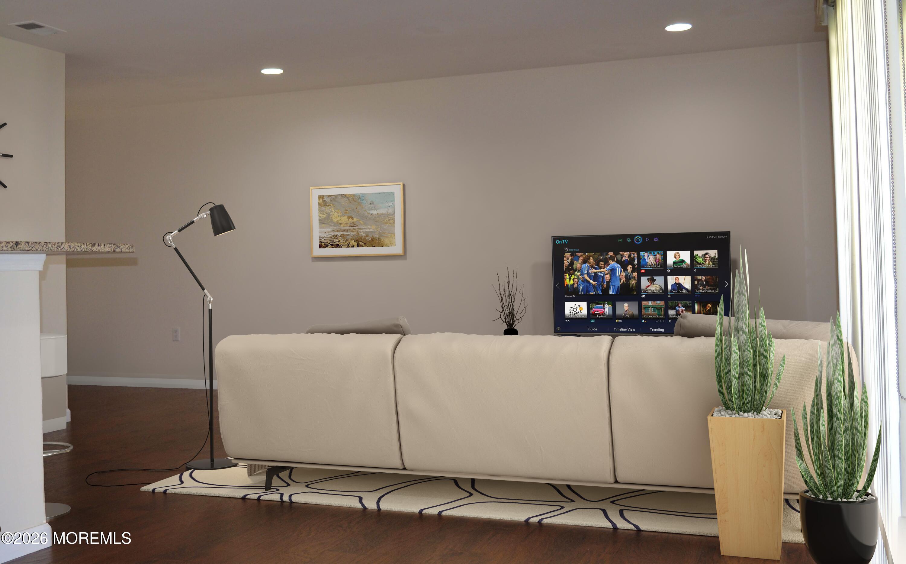 5 Claridge Court, Unit 4 Freehold, NJ 07728 - Photo 3 of 13 a living room with furniture and a potted plant