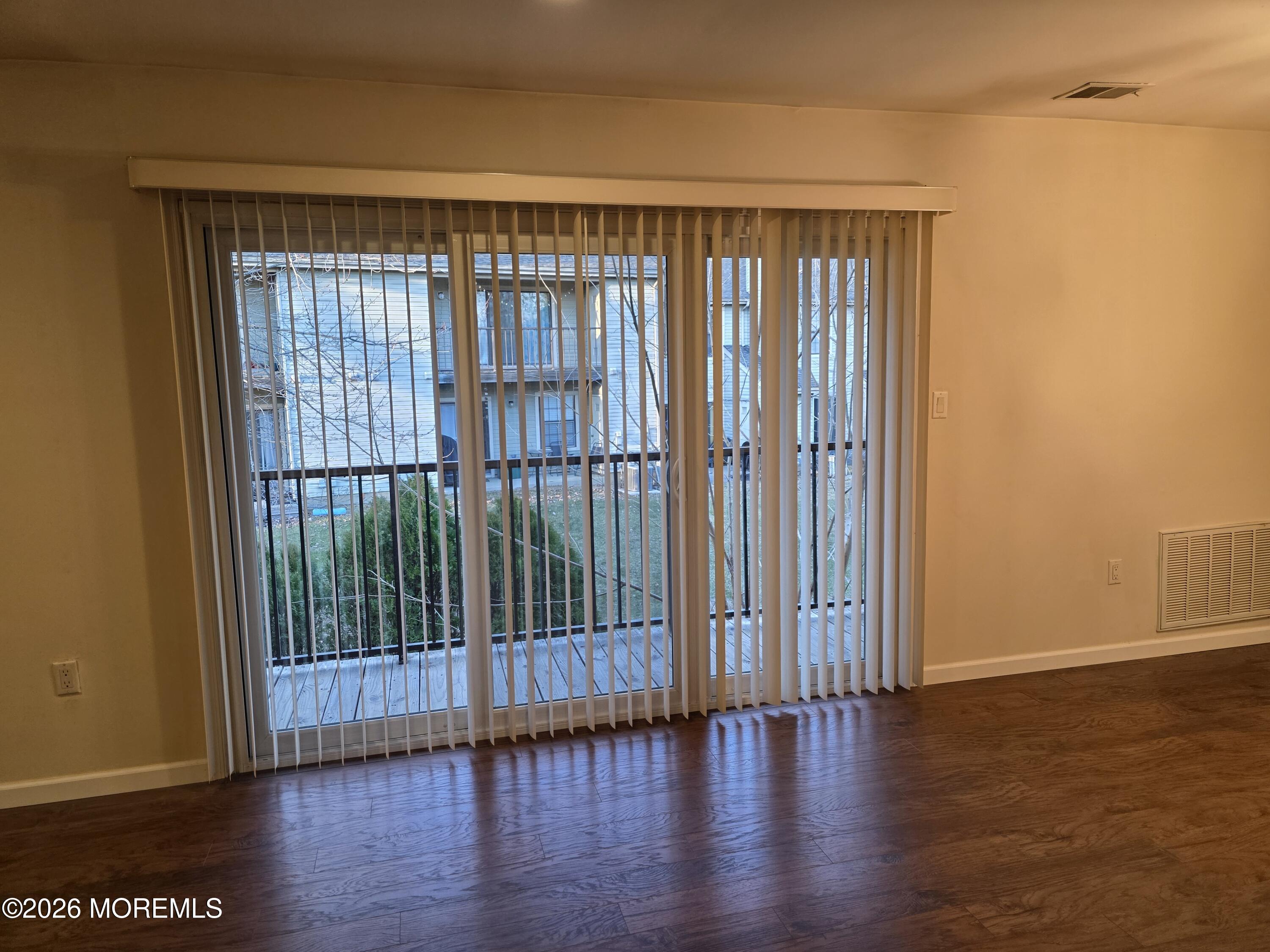5 Claridge Court, Unit 4 Freehold, NJ 07728 - Photo 4 of 13 a view of wooden floor and chair in a room