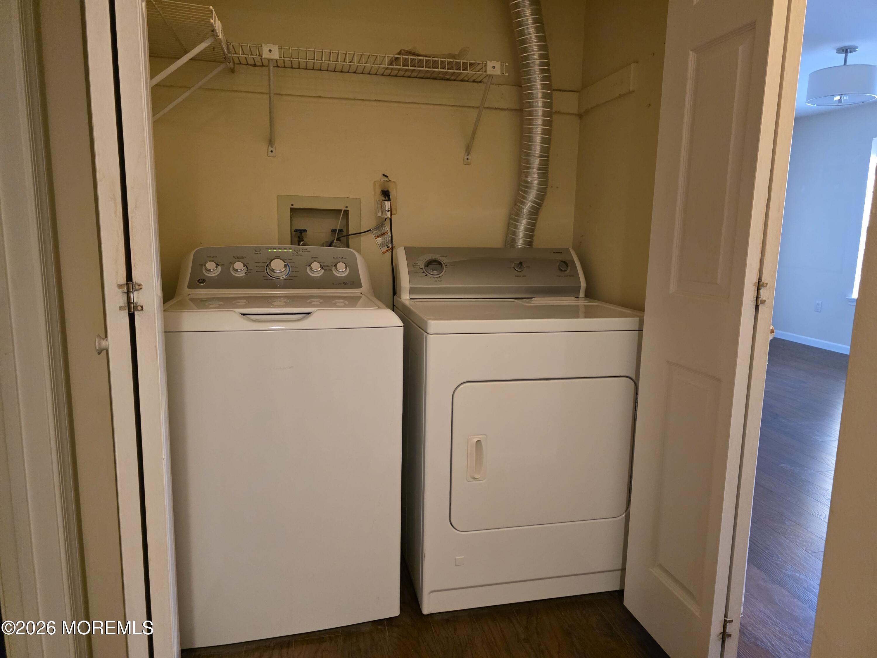 5 Claridge Court, Unit 4 Freehold, NJ 07728 - Photo 8 of 13 a utility room with dryer and washer