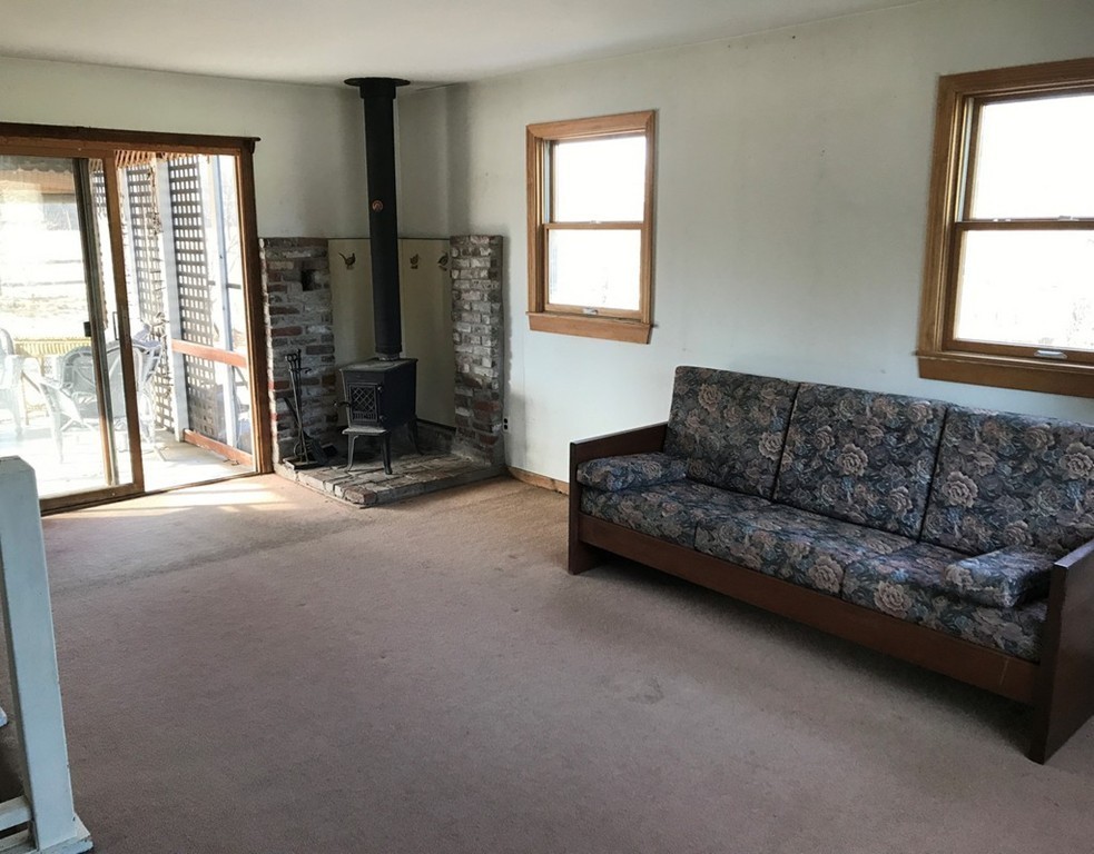 113 Peter Spring Road Concord, MA 01742 - Photo 11 of 13 a living room with furniture and a window