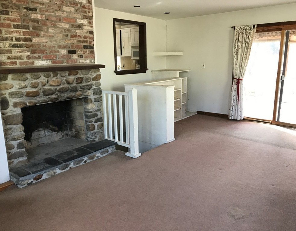 113 Peter Spring Road Concord, MA 01742 - Photo 2 of 13 a view of a livingroom with a fireplace