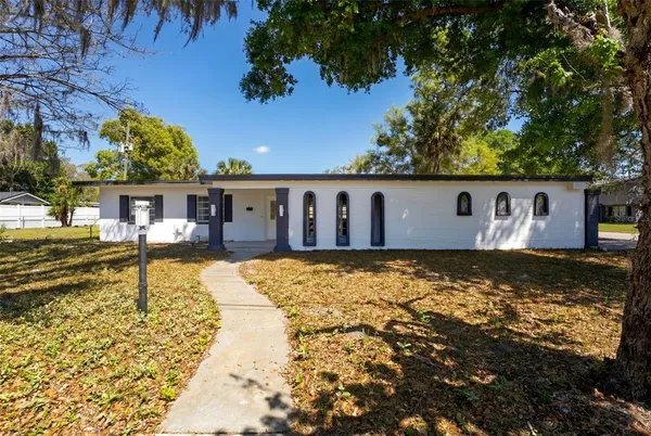 a swimming pool with outdoor seating
