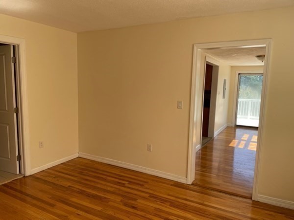 272-2 Nevada Street, Unit 2 Newton, MA 02460 - Photo 7 of 28 a view of empty room with wooden floor