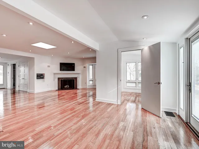 a view of kitchen with cabinets and wooden floor