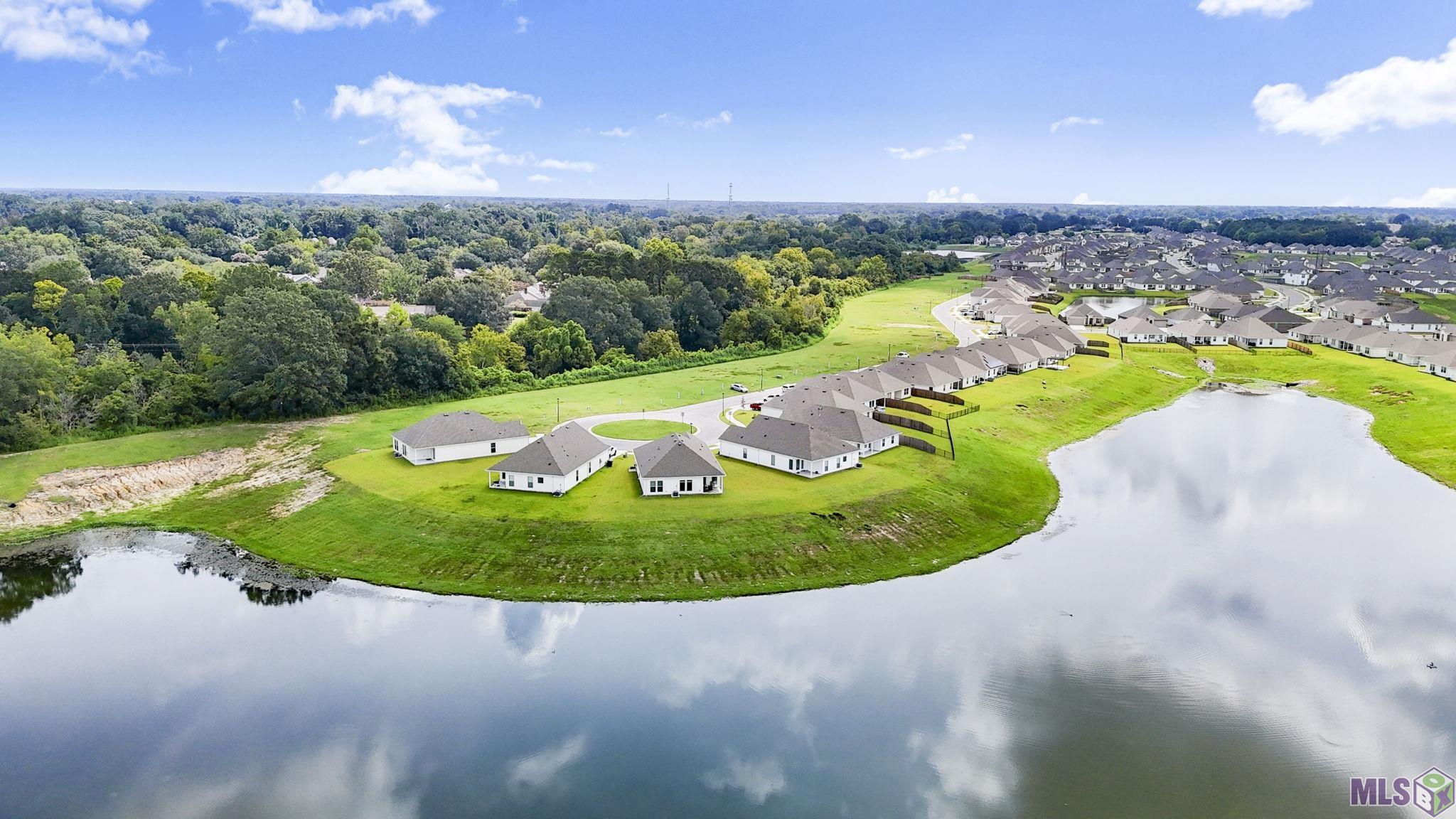 13414 Marsala Court Baton Rouge, LA 70817 - Photo 23 of 31 3rd house from the left on the lake