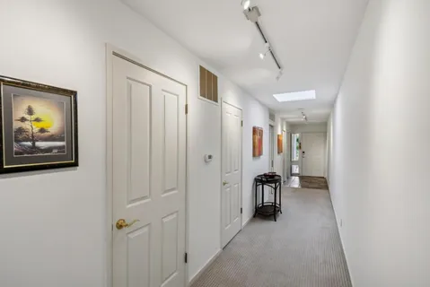 a view of a hallway with front door
