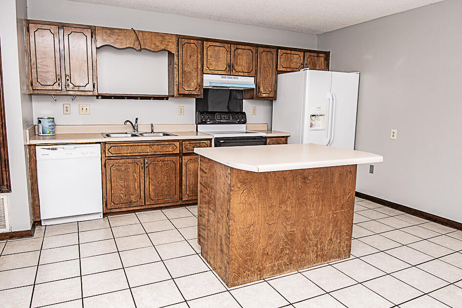 116 Walker Circle West Crestview, FL 32539 - Photo 9 of 20 a kitchen with stainless steel appliances a sink a stove a refrigerator and cabinets