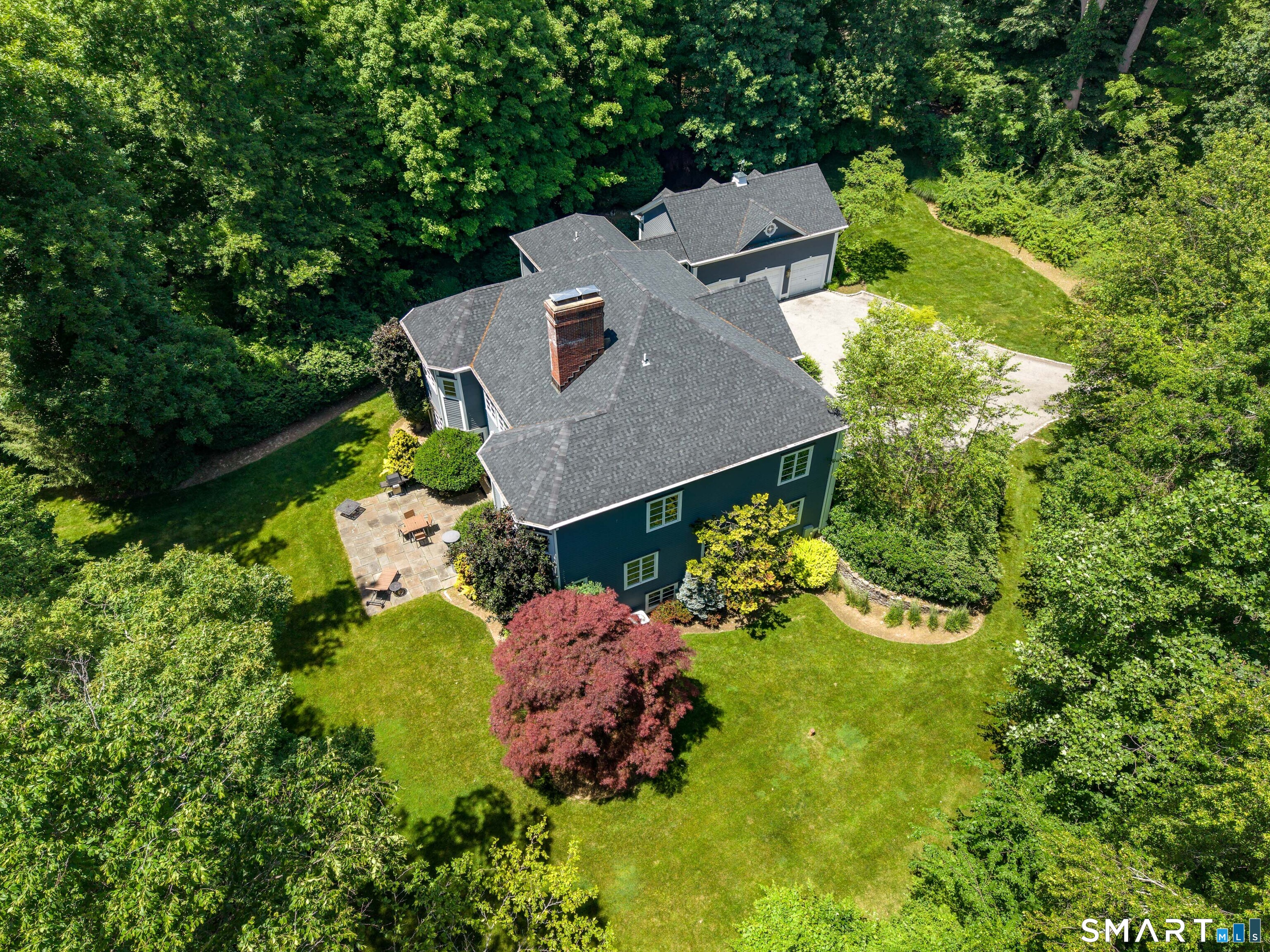 760 Smith Ridge Road New Canaan, CT 06840 - Photo 34 of 40 an aerial view of a house with a yard