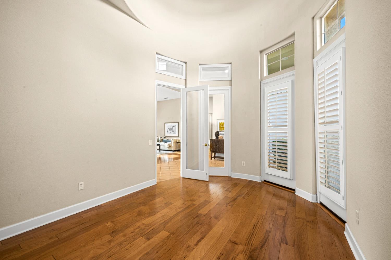 856 Mossy Ridge Lane Lincoln, CA 95648 - Photo 11 of 44 an empty room with wooden floor and windows