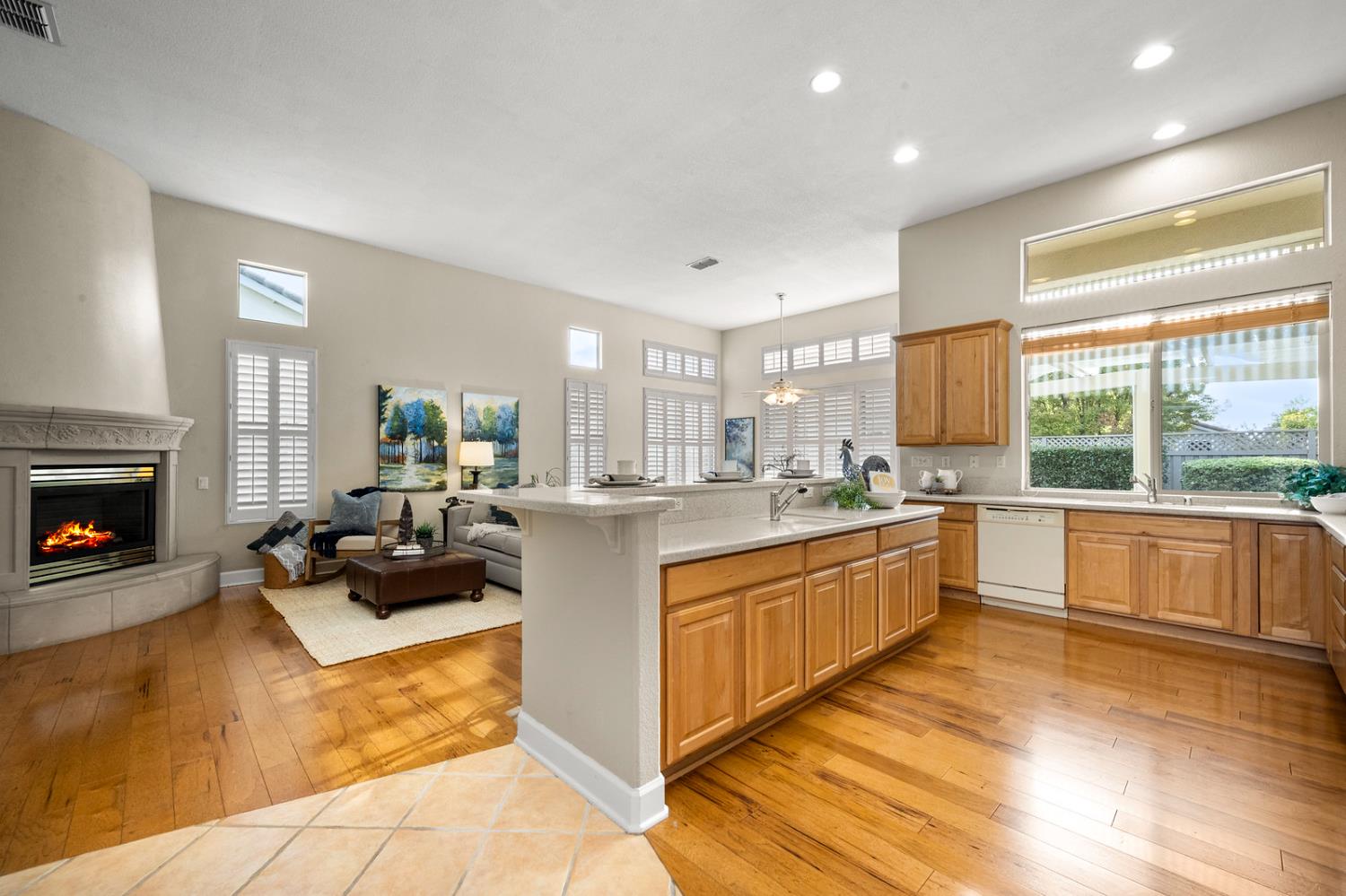 856 Mossy Ridge Lane Lincoln, CA 95648 - Photo 13 of 44 a large living room with stainless steel appliances granite countertop a couch and a view of kitchen next to a large window