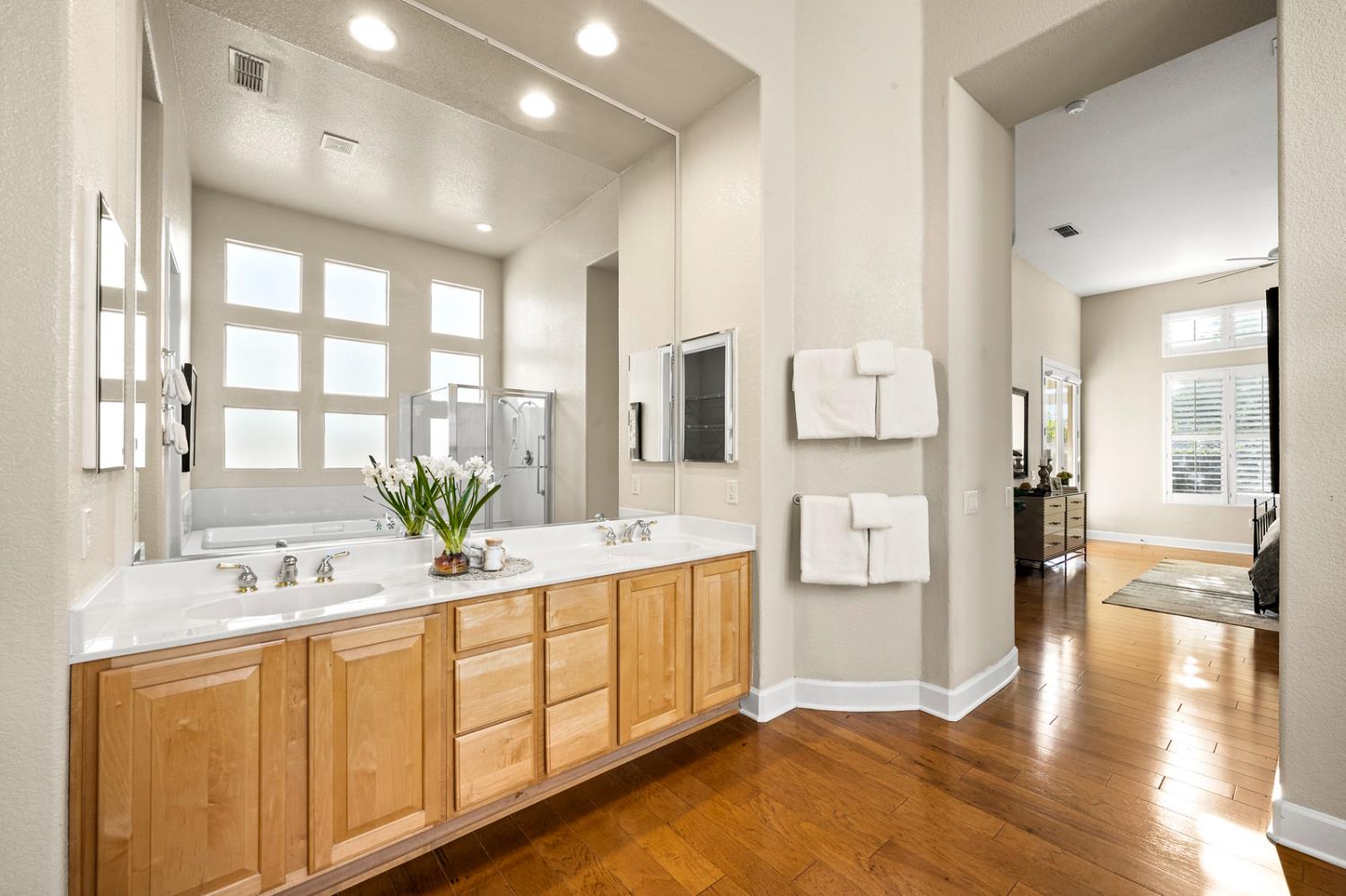 856 Mossy Ridge Lane Lincoln, CA 95648 - Photo 25 of 44 a spacious bathroom with a double vanity sink and a tub