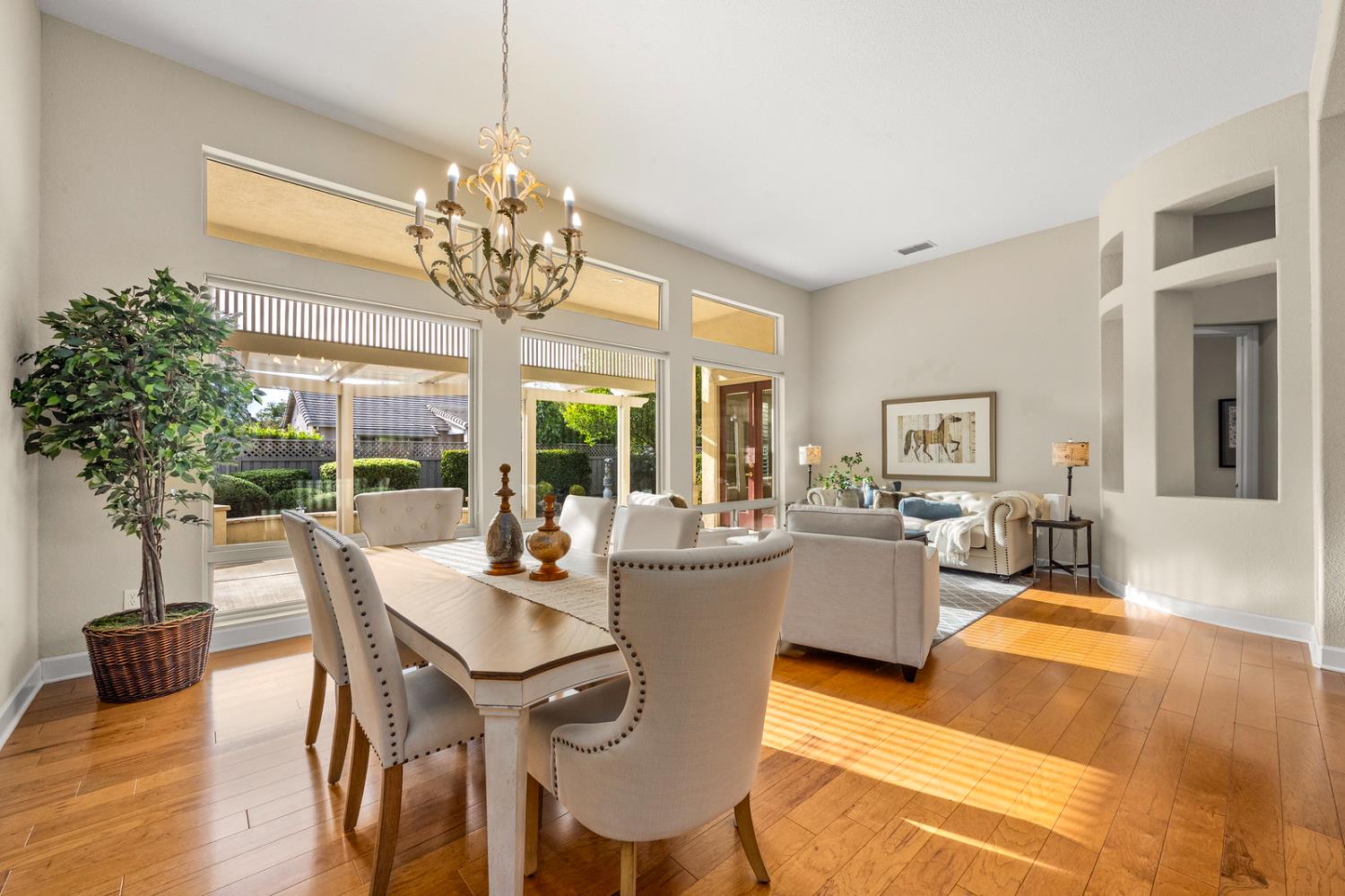 856 Mossy Ridge Lane Lincoln, CA 95648 - Photo 5 of 44 a dining room with furniture a chandelier and wooden floor