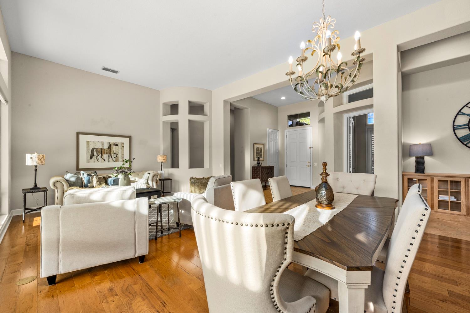 856 Mossy Ridge Lane Lincoln, CA 95648 - Photo 6 of 44 a living room with furniture and a chandelier