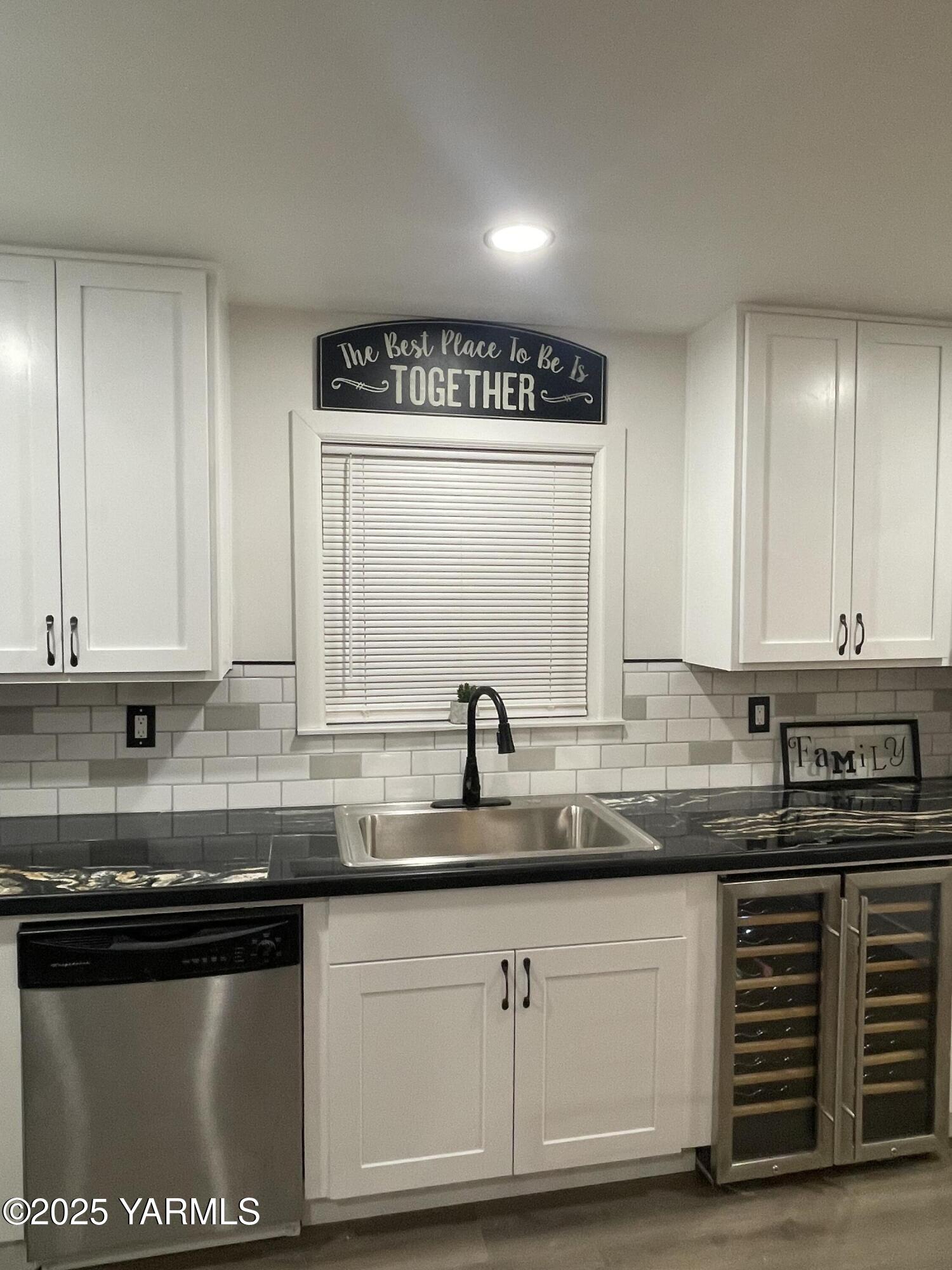 212 West Boulevard, Unit S Granger, WA 98932 - Photo 20 of 40 a kitchen with stainless steel appliances granite countertop a sink a stove and a microwave