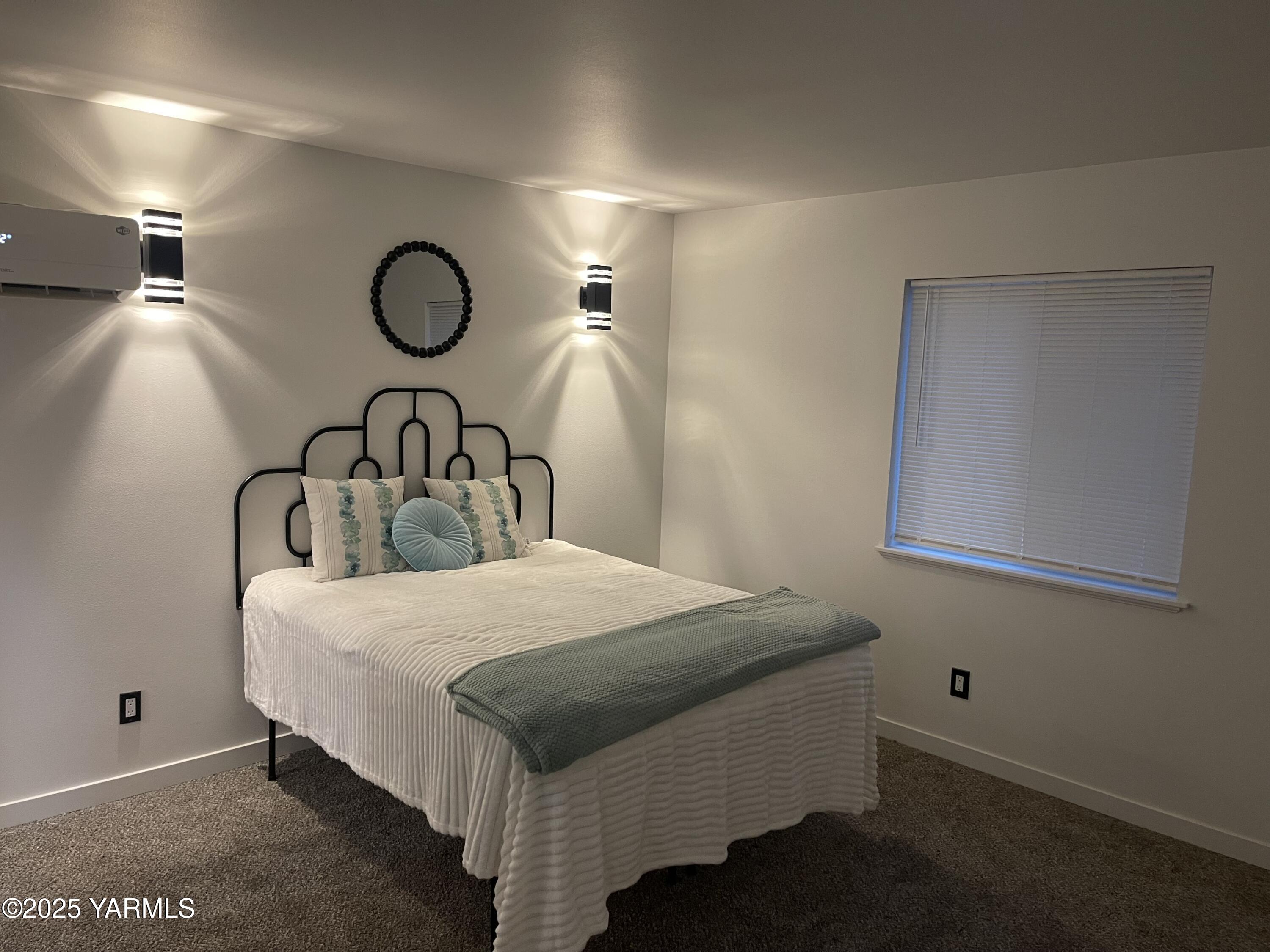 212 West Boulevard, Unit S Granger, WA 98932 - Photo 21 of 40 a bedroom with a bed and ceiling fan