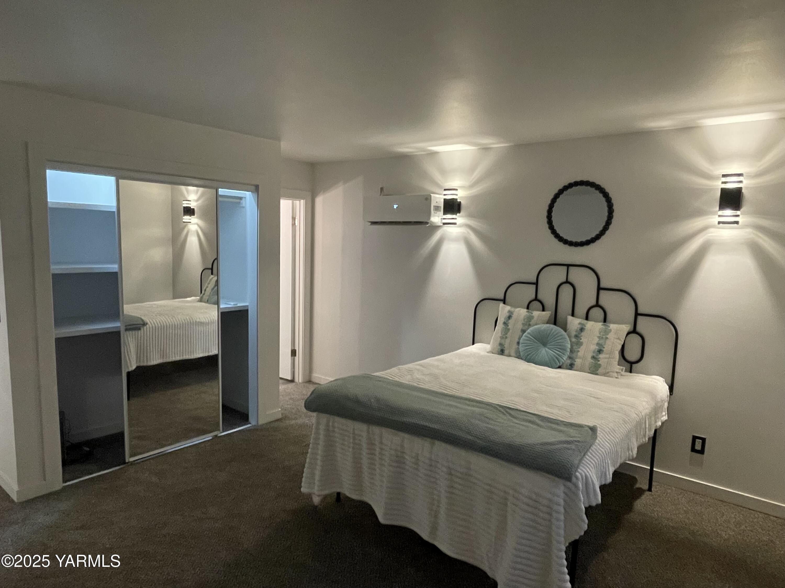 212 West Boulevard, Unit S Granger, WA 98932 - Photo 22 of 40 a bedroom with a bed and furniture