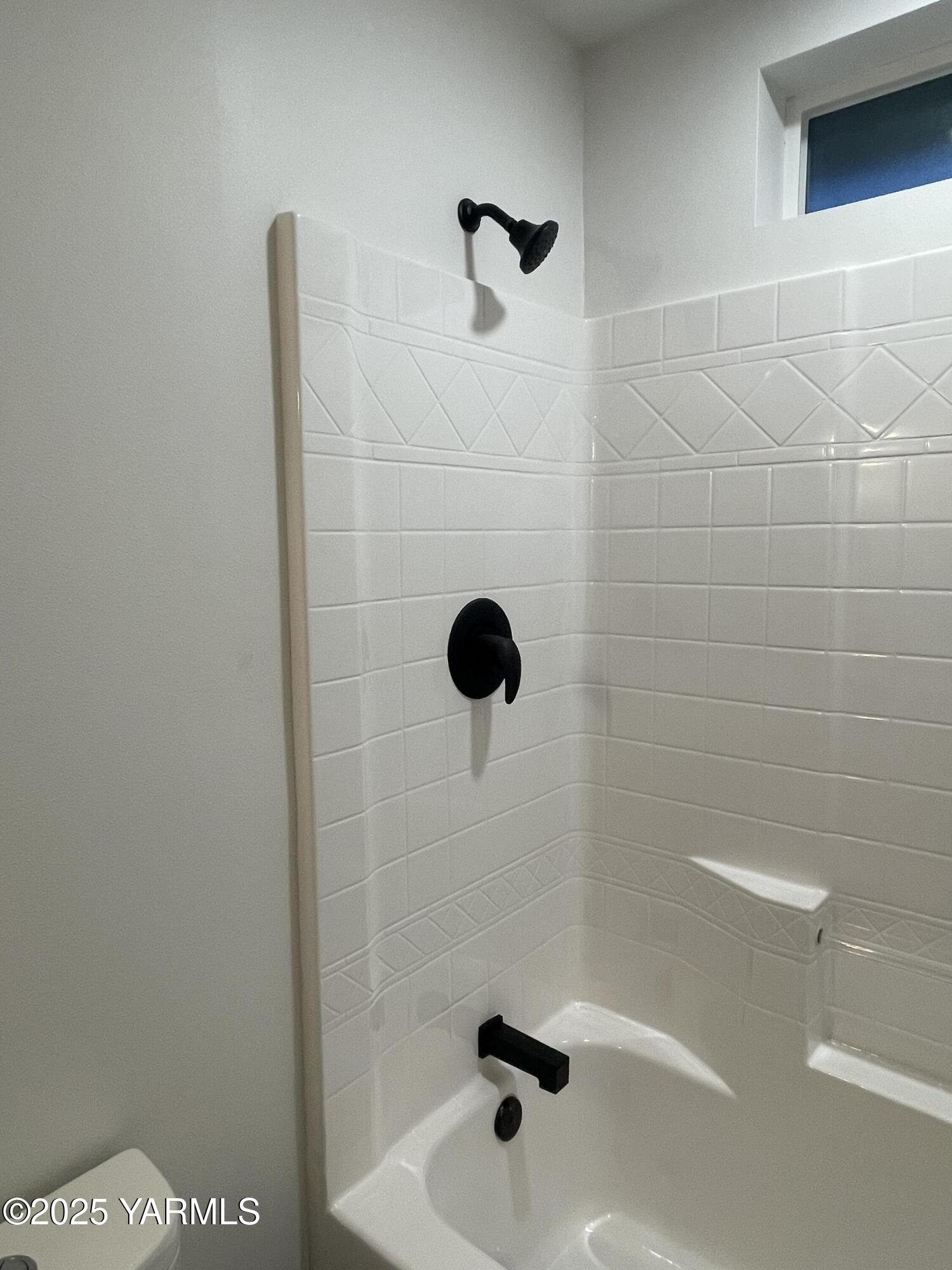 212 West Boulevard, Unit S Granger, WA 98932 - Photo 26 of 40 a bathroom with a shower