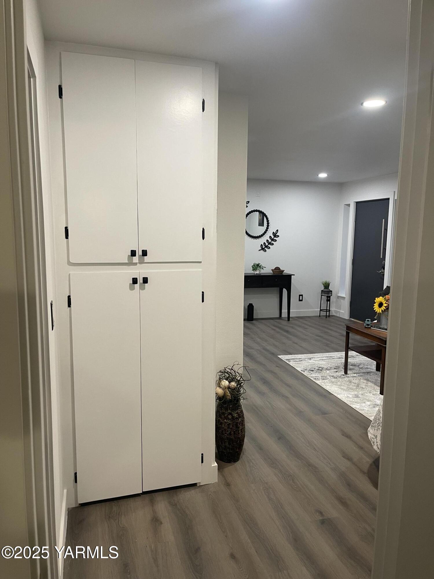 212 West Boulevard, Unit S Granger, WA 98932 - Photo 30 of 40 a view of a room with wooden floor and furniture