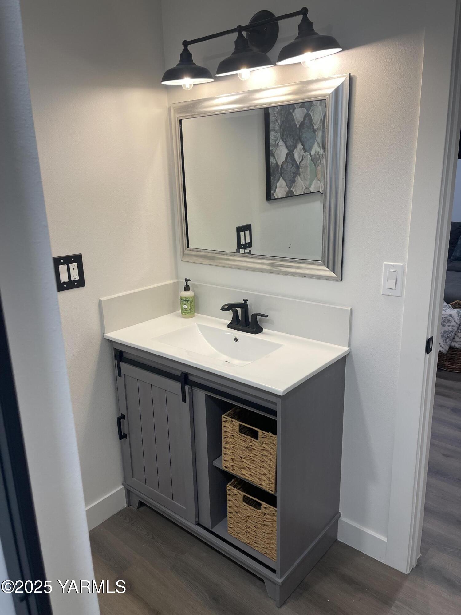 212 West Boulevard, Unit S Granger, WA 98932 - Photo 32 of 40 a utility room with a sink and a mirror