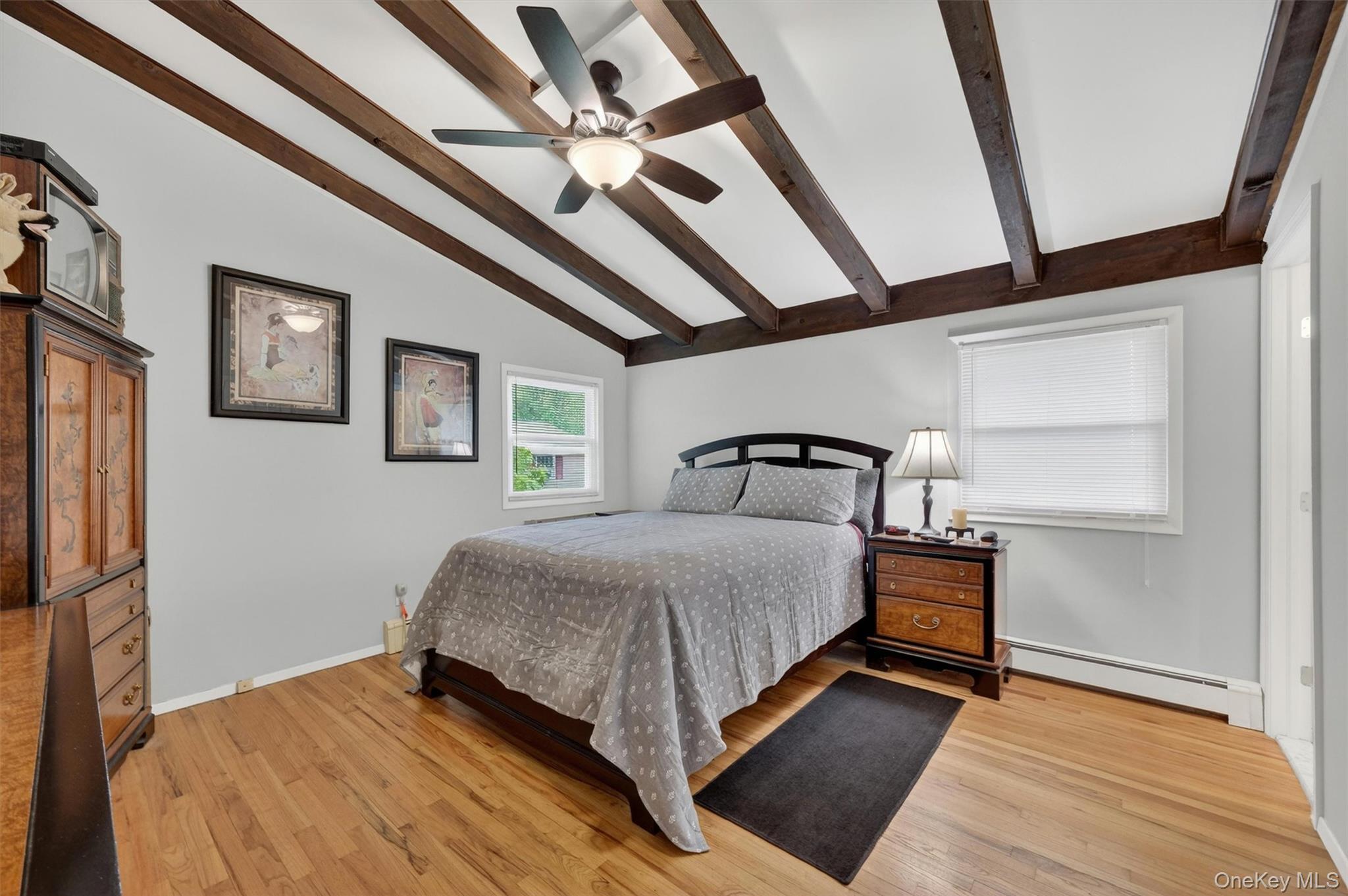 1 Rockledge Road Poughkeepsie, NY 12601 - Photo 18 of 36 Primary bedroom with beamed ceilings, ceiling fan and hardwood floors