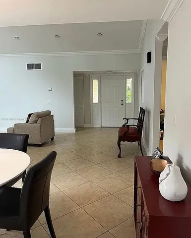 a hallway with furniture and window