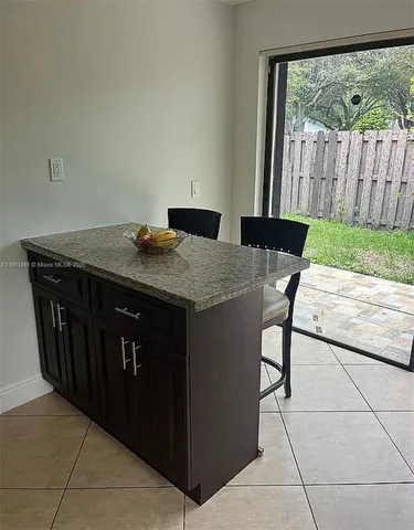 a bedroom with a bed and a piano