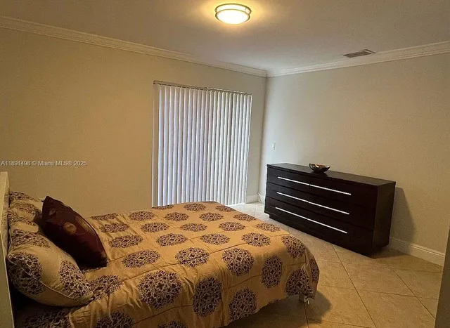 a bathroom with a sink vanity and mirror