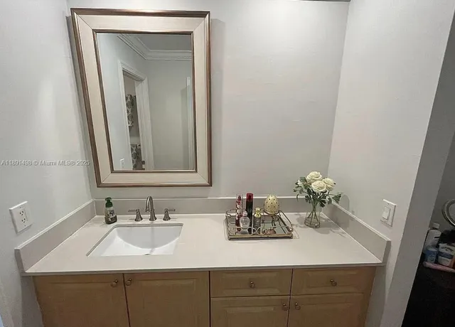 a bathroom with a double vanity sink and a mirror