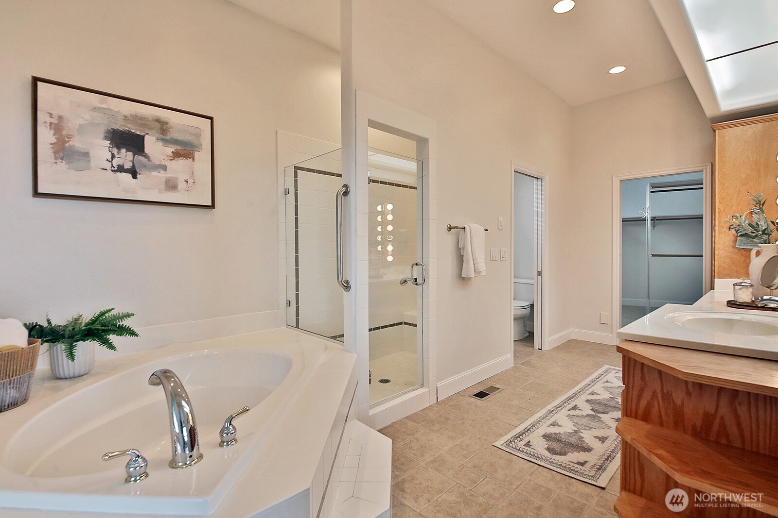 4694 Wrightsman Place Clinton, WA 98236 - Photo 17 of 38 a bathroom with a tub sink and mirror