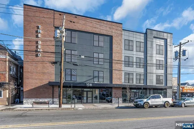 a city street lined with buildings and a street