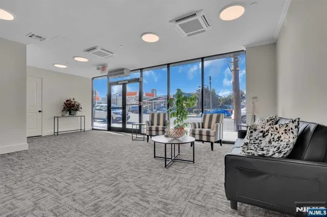 a living room with furniture and a large window