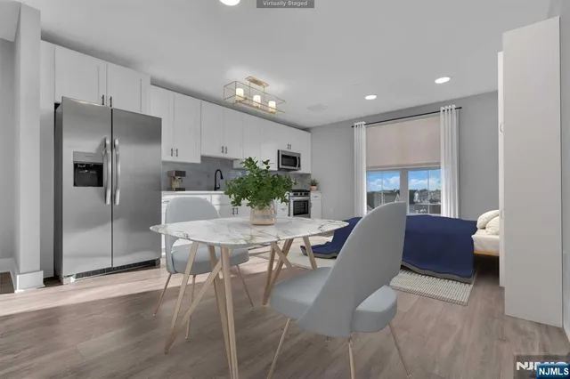 a view of a dining room with furniture window and wooden floor