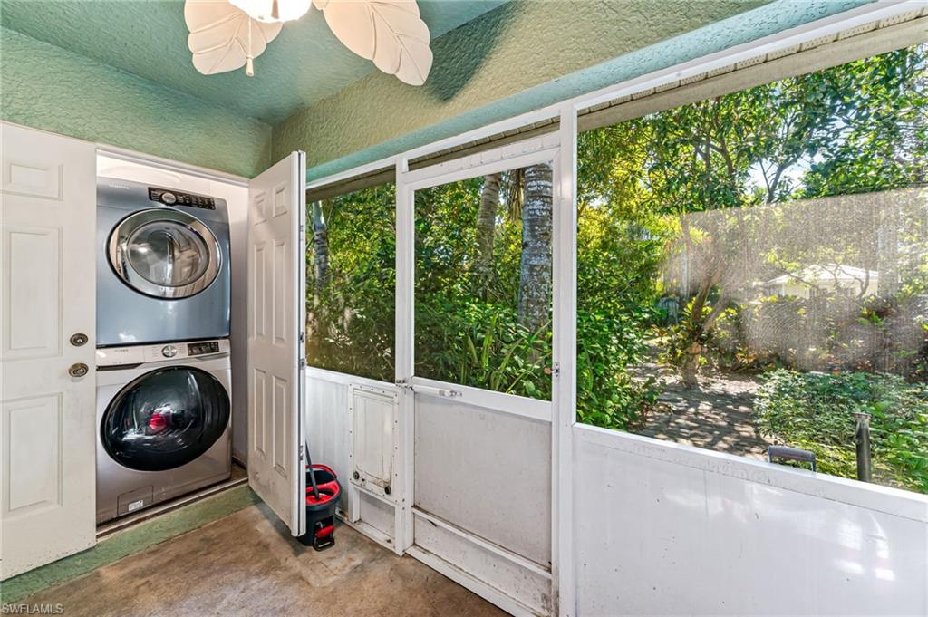 724 Pine Cone Lane Naples, FL 34104 - Photo 21 of 45 a view of a storage and utility car in a garage