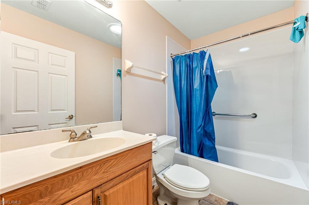 724 Pine Cone Lane Naples, FL 34104 - Photo 28 of 45 a bathroom with a sink a toilet and shower